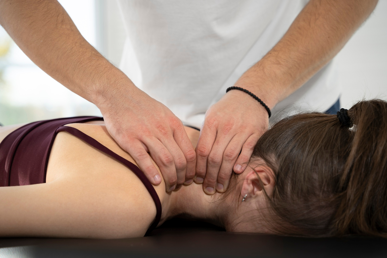 Close up hands massaging neck